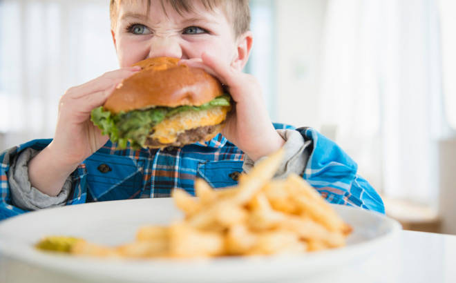 A Child Eating a Burger