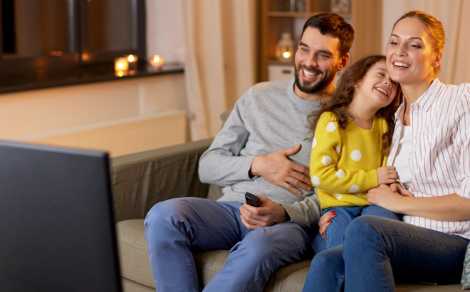A Family Watching TV and Enjoying Their Evening