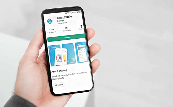 A Hand Holding a Phone with the Swagbucks App On It