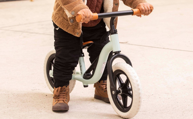 A Kid Riding Chillafish Charlie Breeze Kids Balance Bike