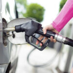 A Person Filling Up a Gas Tank