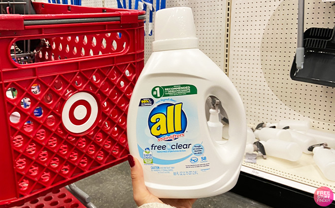 A Person Holding All Liquid Laundry Detergent