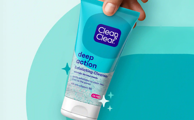 A Person Holding Clean Clear Deep Action Exfoliating Facial Cleanser
