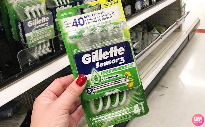 A Person Holding Gillette Sensor3 Sensitive 3 Blade Disposable Razors