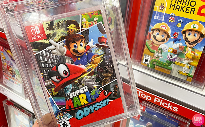 A Person Holding Super Mario Odyssey Nintendo Switch Game