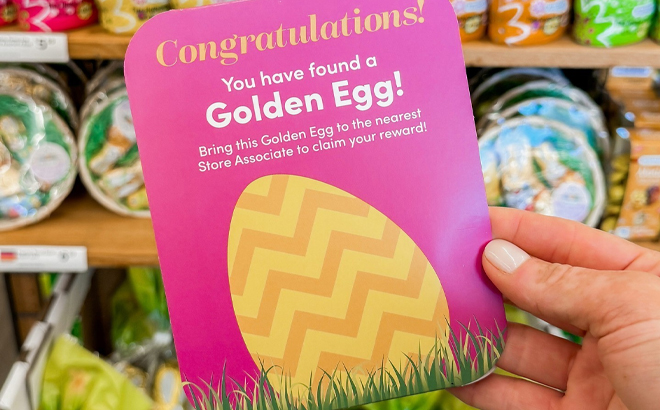 A Person Holding the Golden Egg Hunt Coupon at World Market