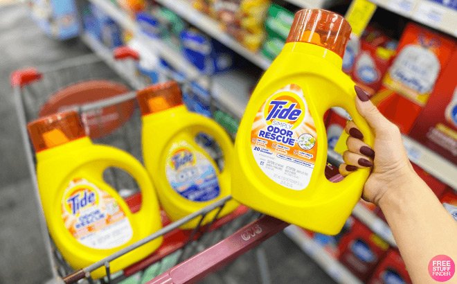 A Person Holding Tide Simply 20 Ounce Detergent