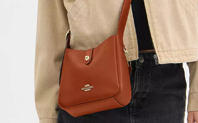 A Person Wearing Coach Outlet Hadley Mini Crossbody Bag in Smooth Leather Color