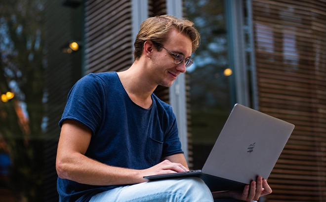 A Person Working on a Laptop