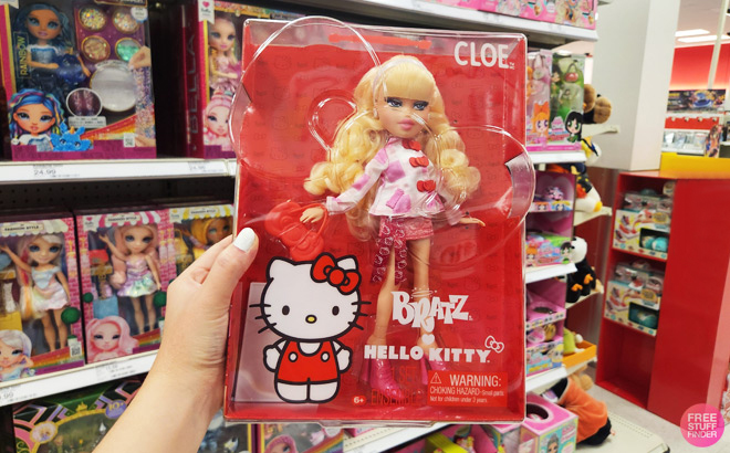 A Woman Holding Bratz x Hello Kitty Cloe Sanrio Fashion Doll with Accessories