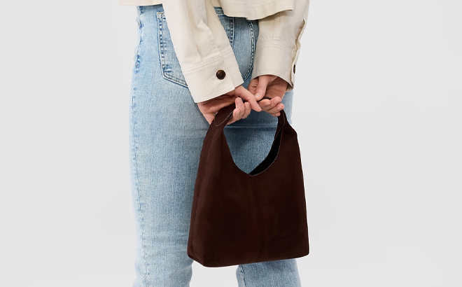 A Woman Holding GAP Factory Mini Faux Suede Handbag