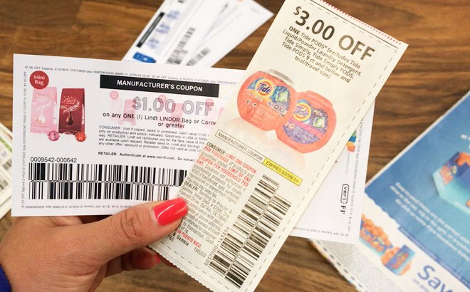 A Hand Holding Coupons A Hand Holding Coupons