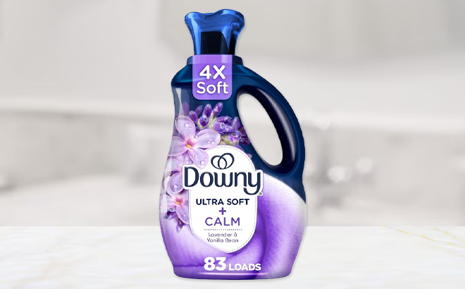 Downy 83 Loads Ultra Soft Calm Fabric Softener on a Table
