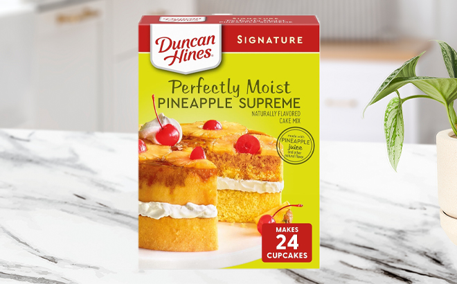 Duncan Hines Pineapple Supreme Flavored Cake Mix on a Kitchen Counter Duncan Hines Pineapple Supreme Flavored Cake Mix on a Kitchen Counter