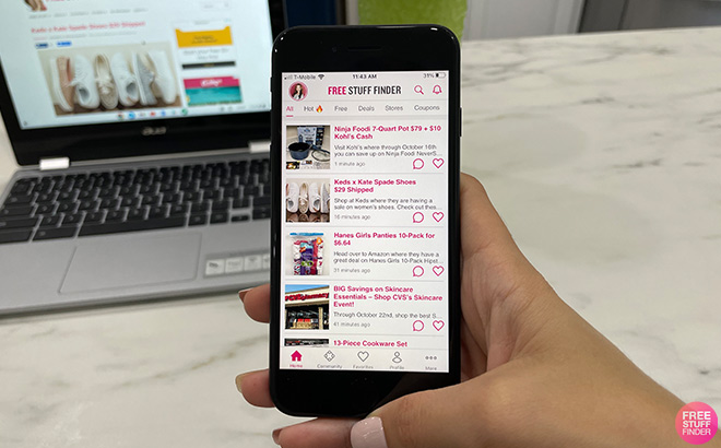 A Hand Holding a Phone with Free Stuff Finder App Open on it