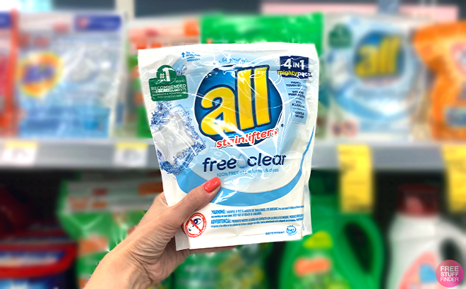 Hand holding All Free and Clear Mighty Pacs Laundry Detergent 19 Counts