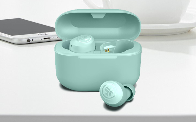 JLab Go Air Pop True Wireless Earbuds in Mint Green Color on the Table JLab Go Air Pop True Wireless Earbuds in Mint Green Color on the Table