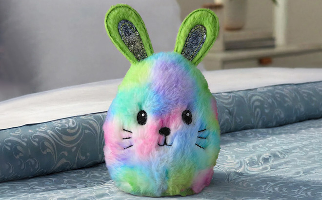 Way To Celebrate Oval Bunny Plush on the Bed